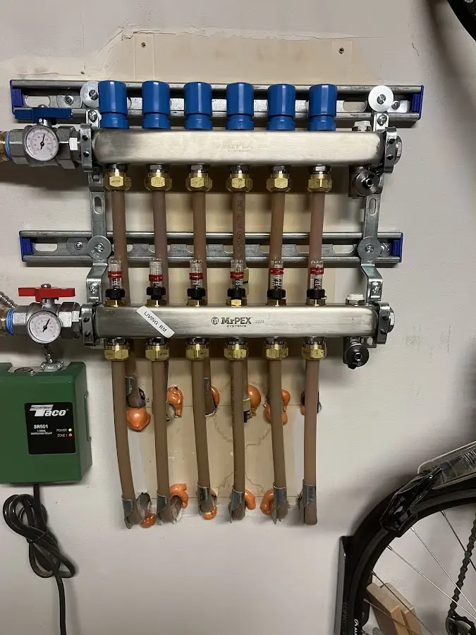 Plumber performing Water Heater Repair at a residential property in Swannanoa